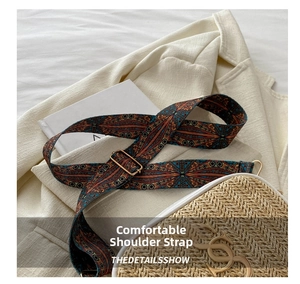 Close-up of bohemian woven shoulder strap with intricate patterns and gold metal buckles
