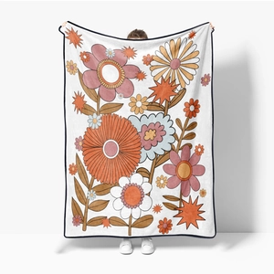 Thick flannel blanket with 70s vintage floral pattern in warm orange and pink tones