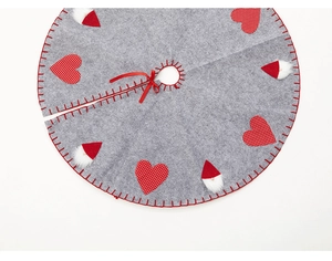 Detail of 1M grey felt Christmas tree skirt with red heart and Santa hat appliques