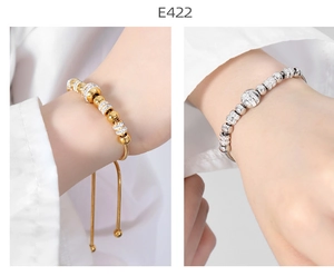 Detail of gold and silver beaded snake chain bracelets with sparkling rhinestones