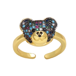Adjustable gold bear ring for women with colorful inlaid stones on a white background