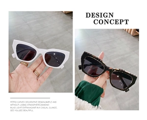 Detail view comparing white and tortoiseshell retro cat eye sunglasses with dark lenses