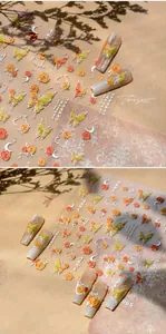 Detail of 3D embossed butterfly and floral nail stickers with a vibrant spring theme
