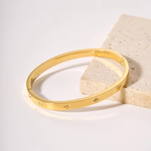 18k gold plated stainless steel starburst bangle with zircon on beige stone