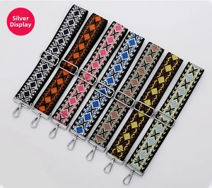 Close-up of bohemian wide bag straps with silver hardware in seven geometric patterns