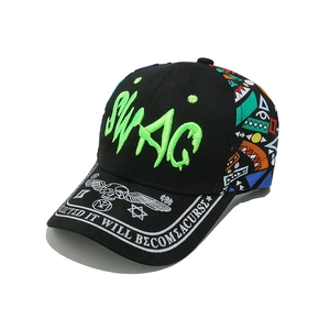 Close-up of Swag graffiti embroidery and skeletal graphics on a street style baseball cap