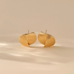 Irregular striped vortex earrings in gold finish with textured pleated shell design