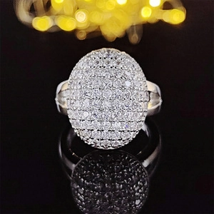 Macro shot of silver geometric ring featuring a sparkling oval pave-set zircon surface