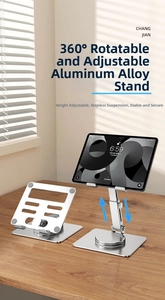 Aluminum tablet stand with 360 rotation and height adjustment on wood desk