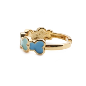 Detailed side view of golden adjustable ring with blue enamel bear motif on white background