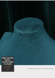 Detail of teal velvet jewelry bust showing the thick sponge padding and soft texture