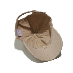 Detail view of khaki baseball cap interior showing six-panel stitch and adjustable strap