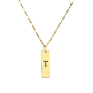 Detail of gold rectangular pendant with colorful stones forming letter T on a fine chain