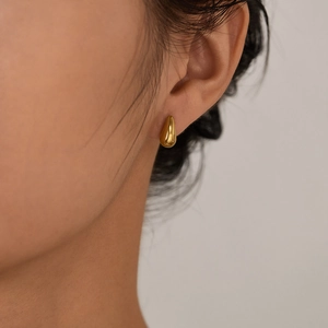 Polished gold teardrop stud earrings for women with minimalist stainless steel design