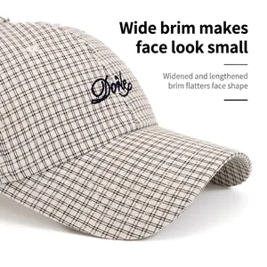 Checkered cotton baseball cap with wide brim and letter embroidery for face-shaping