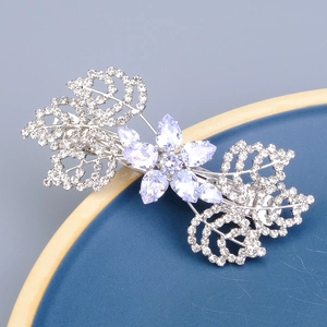 Elegant purple crystal flower hair clip with rhinestone leaf accents on silver base