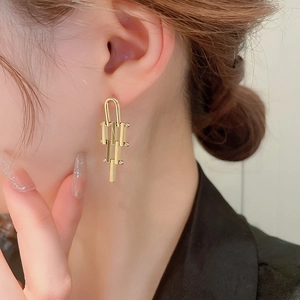 Elegant gold irregular geometric drop earrings for women with minimalist metallic style