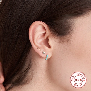 S925 sterling silver turquoise earring set featuring geometric studs on model's ear