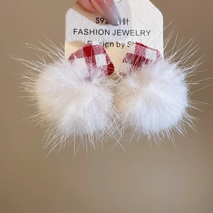 Macro view of S925 silver stud with red plaid heart and white fluffy faux fur ball detail