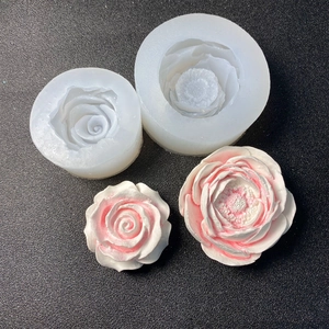 Detailed white silicone mold for DIY flower soaps and candles with finished peony petals