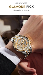 Wrist shot of luxury waterproof men's watch with skeleton dial and two-tone steel strap