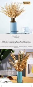 Detail of artificial golden eucalyptus leaf branch for elegant holiday home decor