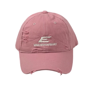 Pink distressed baseball cap with embroidered logo and vintage frayed hole details