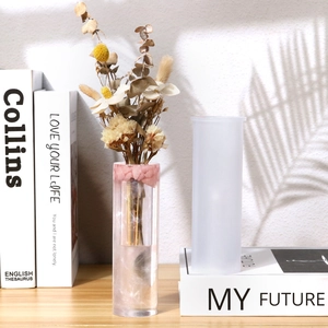 Cylindrical silicone mold for DIY resin flower vases with pink glitter finished product