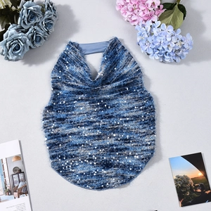 Close-up of deep blue sequin knit crop top with delicate texture and sparkly details