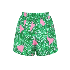 Detail of pink shorts with tropical green leaf print and elastic waistband for surfing