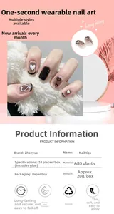 Detail of short black heart false nails with glossy finish and gradient nude base colors