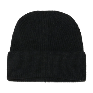 Close-up of the black ribbed knit texture on the cuffed winter beanie hat