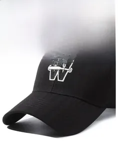 Detail of black baseball cap with white W embroidery and firm curved brim design