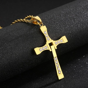 Detail of gold Dominic Toretto cross pendant with crystals on a twisted rope chain