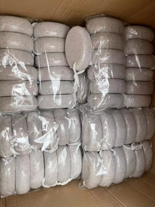 Bulk gray volcanic pumice stones for foot care, individually wrapped in a shipping box