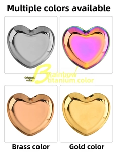 Detail view of heart-shaped stainless steel trays in silver, gold, brass, and rainbow colors