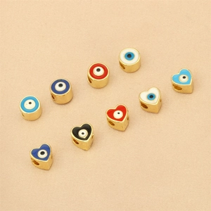 Evil eye pendants in heart and round shapes with gold plating and colorful enamel finish