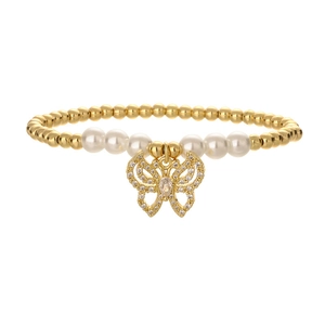 Detail of gold beads and white pearls bracelet featuring a sparkling zircon butterfly charm