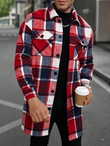 Detail of red and blue plaid flannel jacket with dual chest pockets and button closure