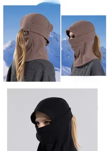 Detail of winter balaclava with ponytail hole for women in black and tan colors
