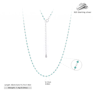 Macro shot of 925 sterling silver chain with turquoise beads and 925 hallmark tag