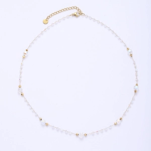 Close-up of golden titanium steel chain with iridescent crystal beads and lobster clasp