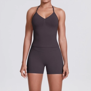 Detail view of the seamless charcoal grey halter neck sports bra with ruched V-neckline