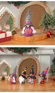 Detailed view of four handmade Halloween gnomes with pumpkin and skull festive patterns