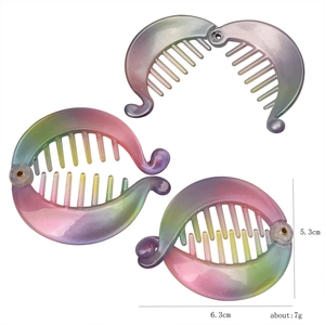 Iridescent banana hair clips measuring 6.3x5.3cm showing size and weight details
