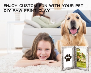 Detail of DIY pet paw print memorial kit with double wooden frame and clay imprint