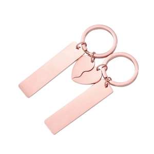 Detailed view of rose gold stainless steel rectangle tags and joinable heart keychain set