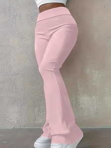 Side view of high-waisted pink flare leggings showing slim fit and elastic fabric