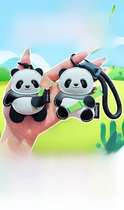 Detail of panda leather keychains with lychee texture and braided lanyards for bags