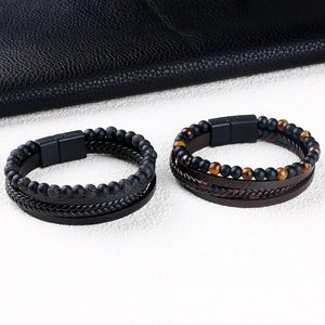 Detail view of multi-layer leather braided bracelets with matte beads and magnetic clasp